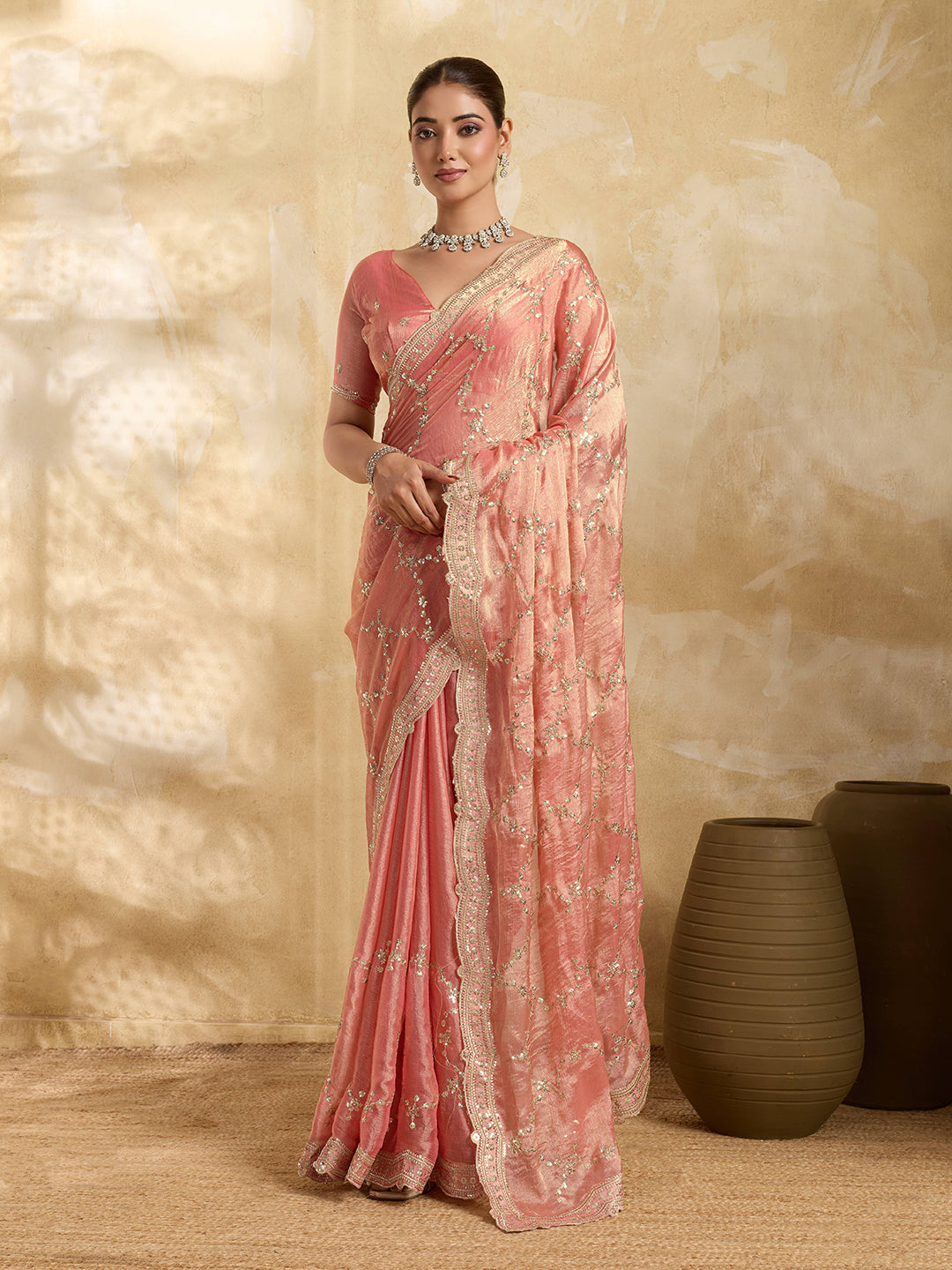 Peach Jimmy Choo party wear saree with sequin embroidery and matching unstitched blouse