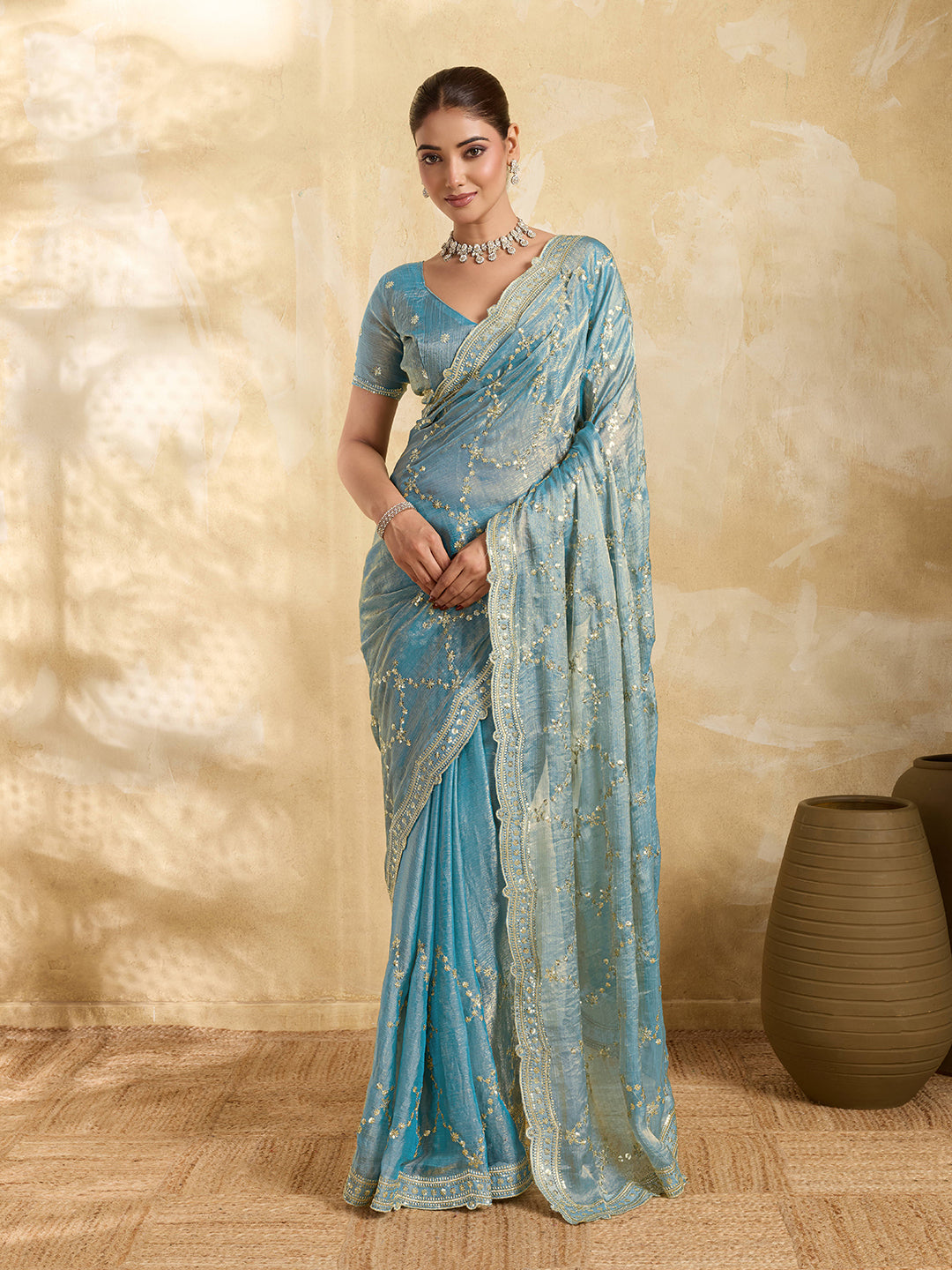 Sky blue Jimmy Choo party wear saree with sequin embroidery and matching unstitched blouse