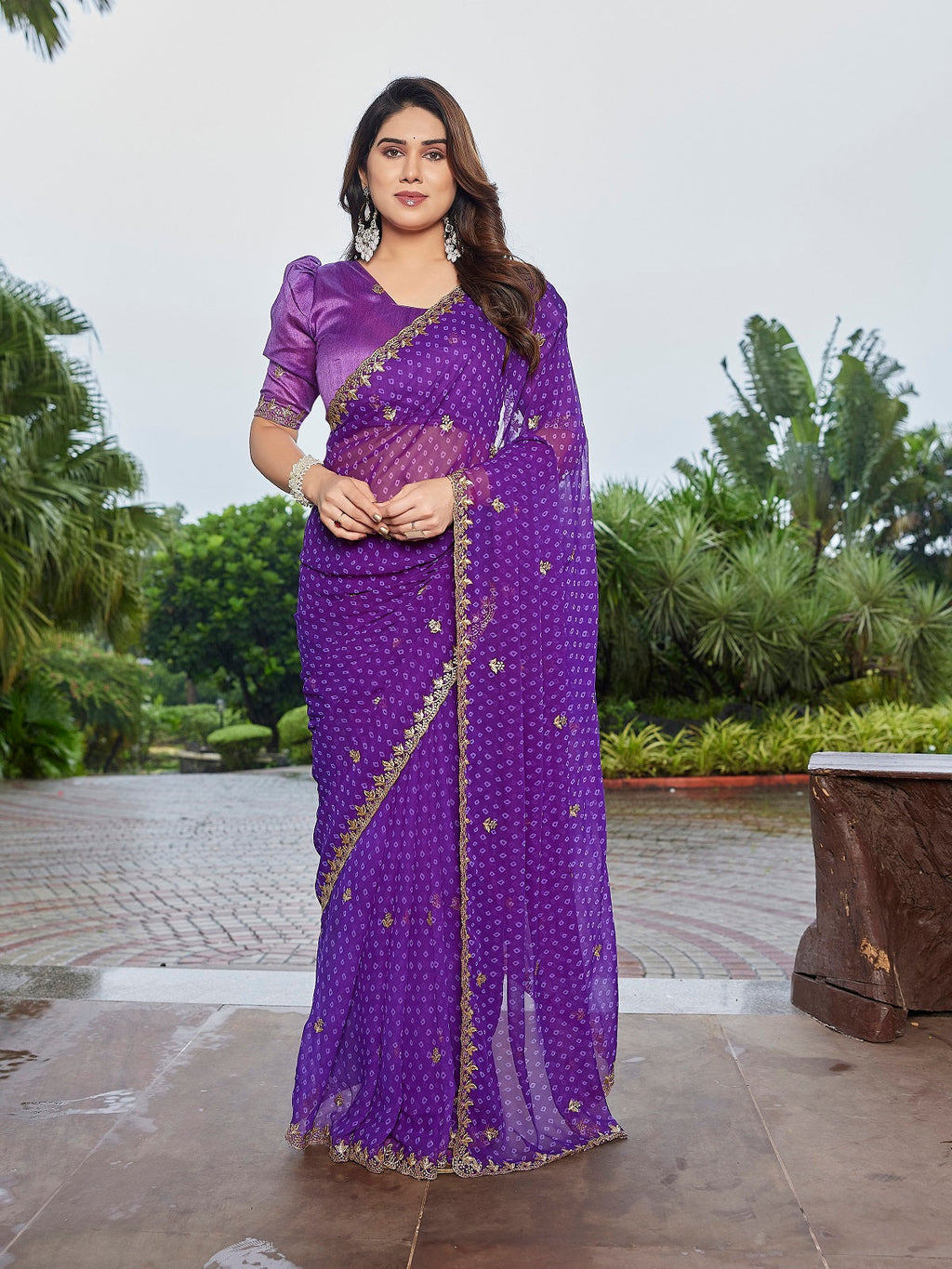 Purple embroidered georgette party wear saree with unstitched blouse