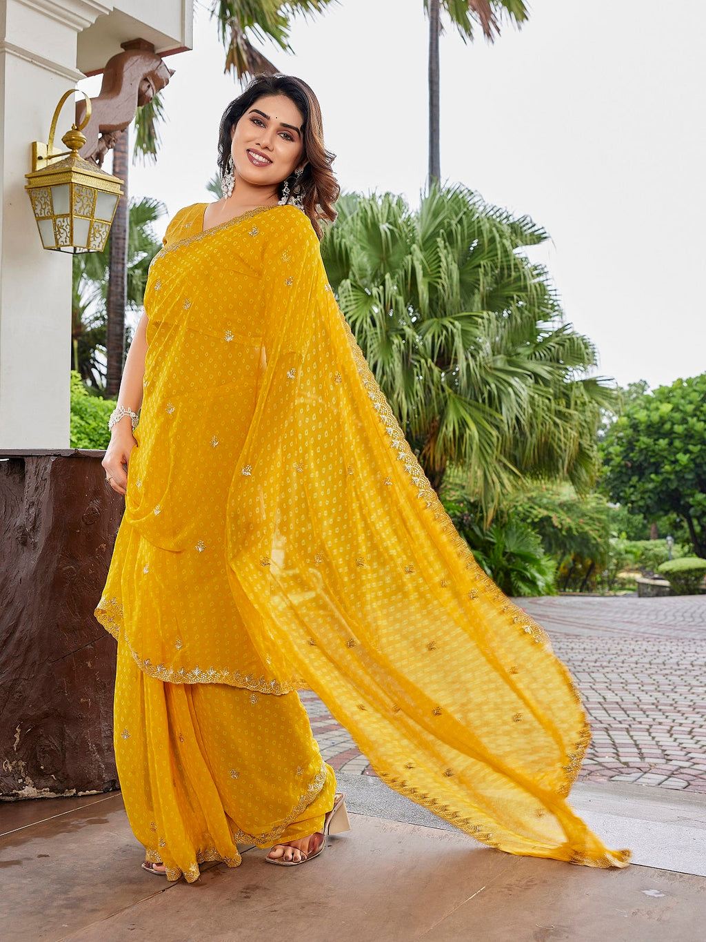 Yellow embroidered georgette party wear saree with unstitched blouse piece