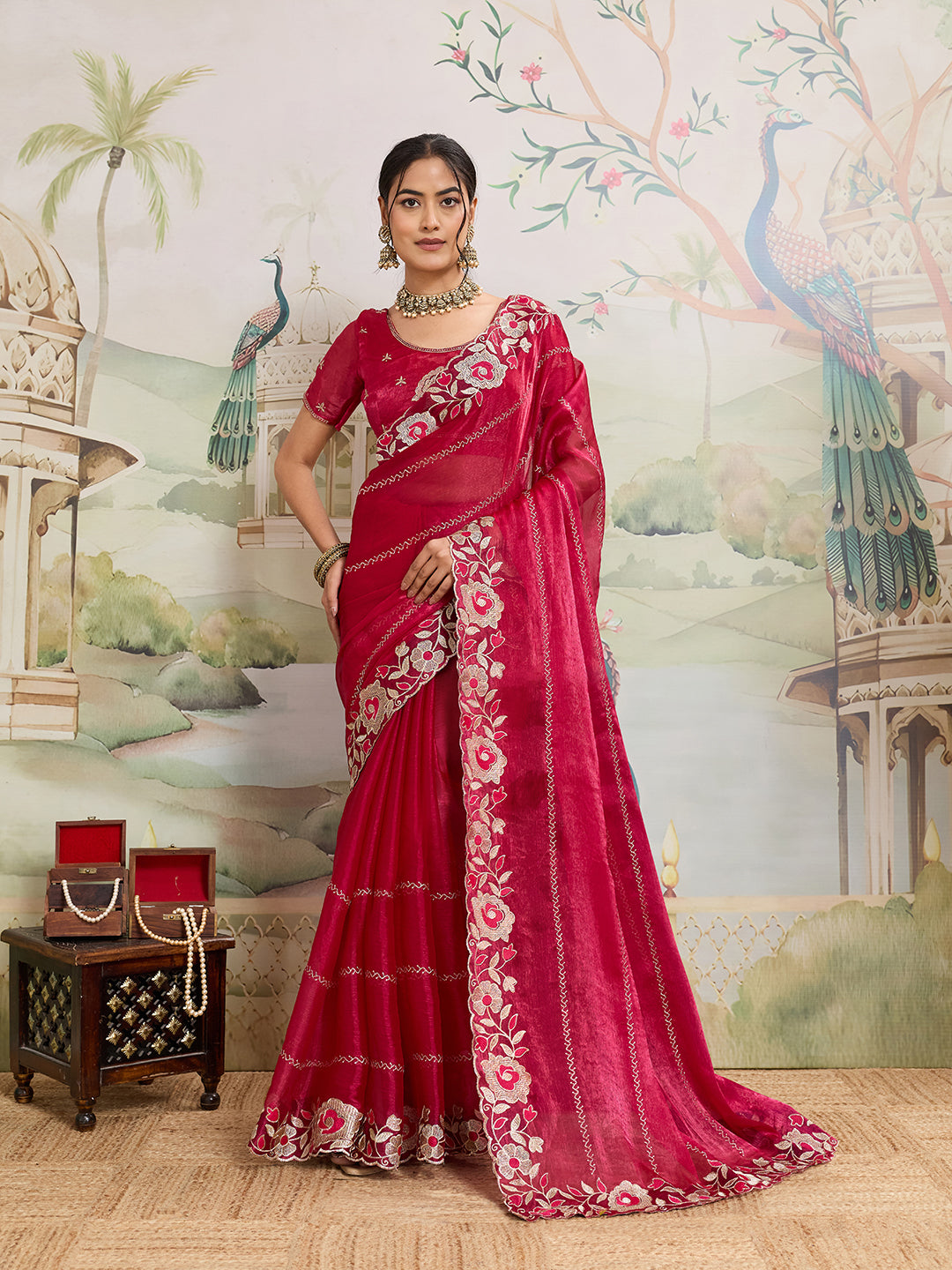 Elegant pink Jimmy Choo Organza saree featuring detailed embroidery and a matching unstitched blouse.