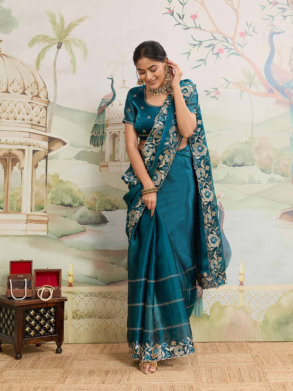 Rama color Jimmy Choo Organza saree featuring elegant embroidery work with unstitched matching blouse piece