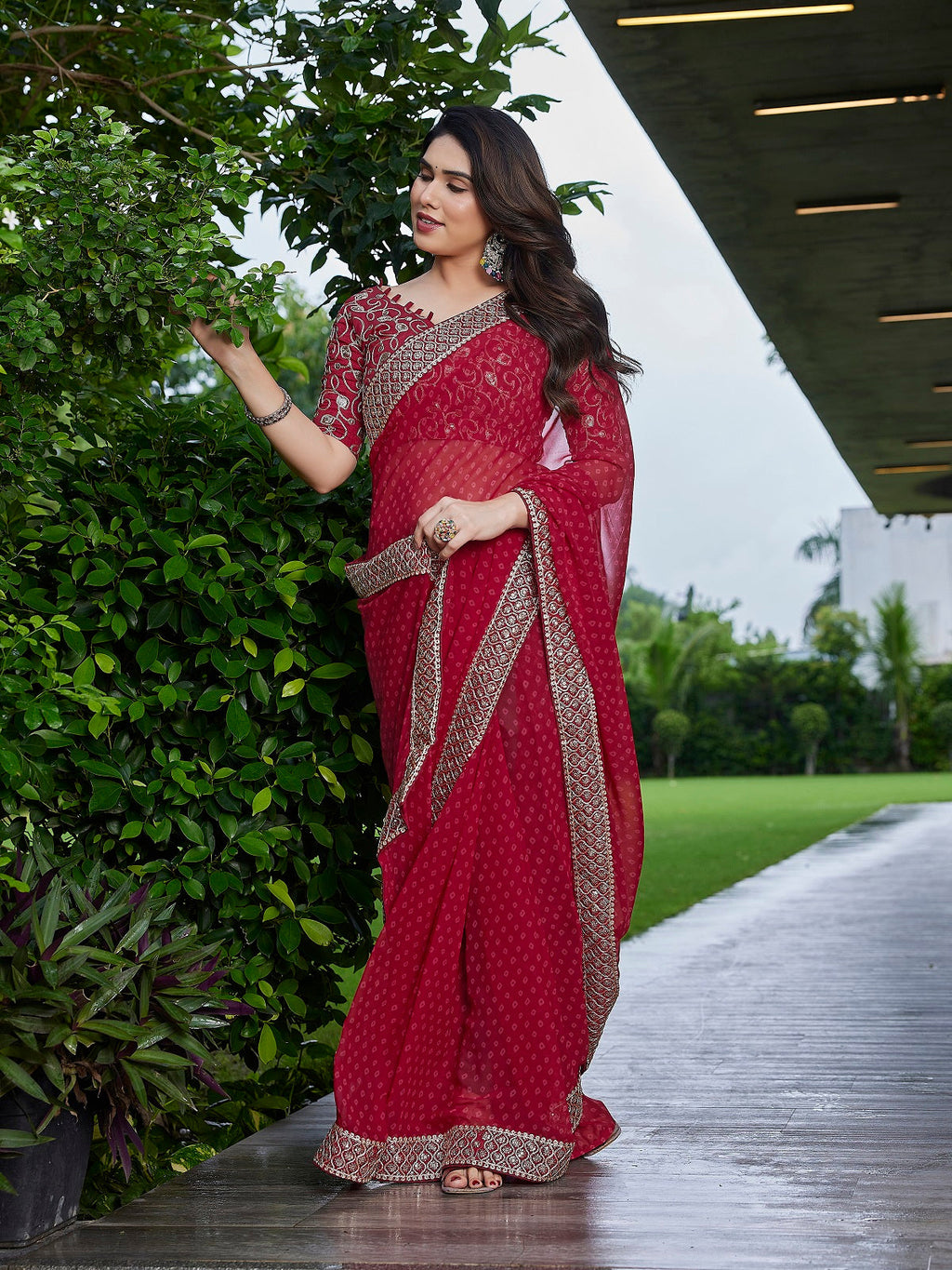Dark maroon embroidered georgette party wear saree with unstitched blouse
