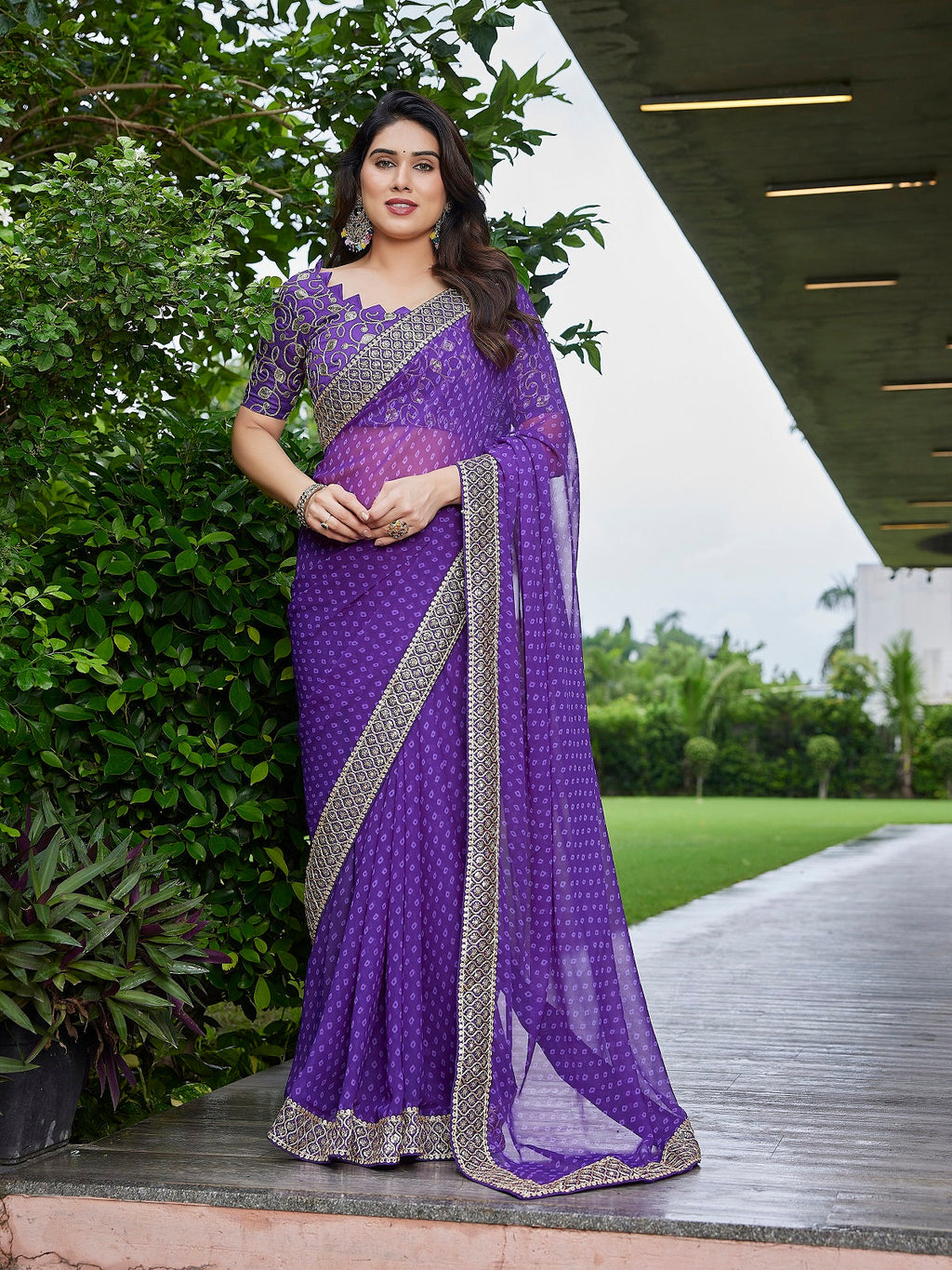 Purple georgette party wear saree with intricate embroidery