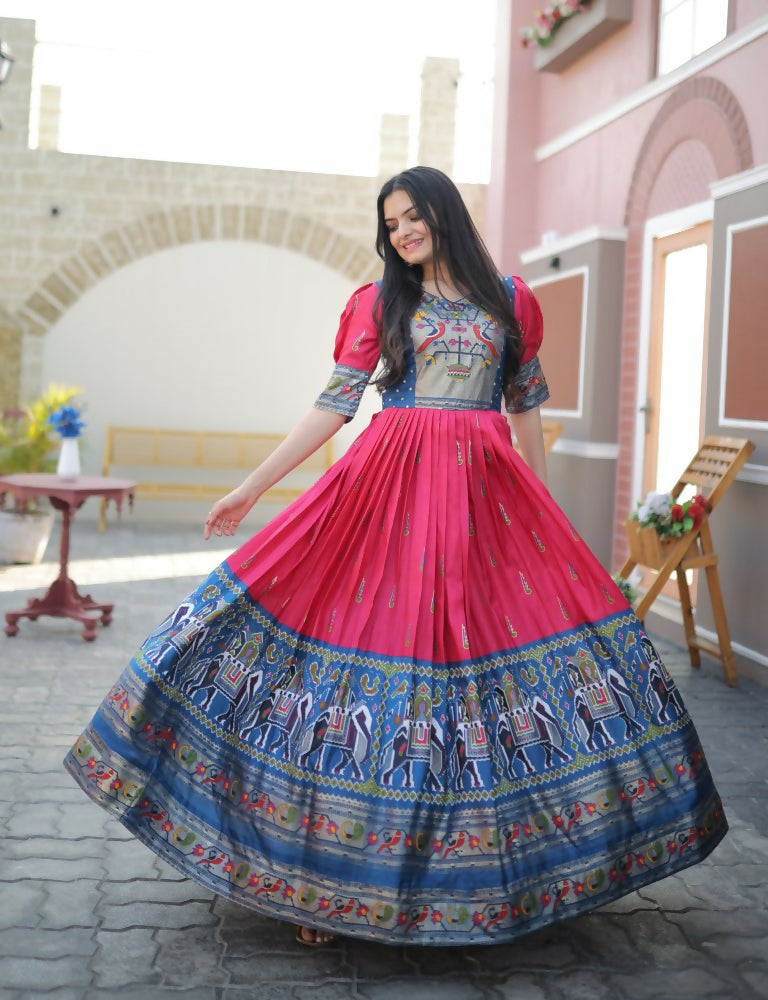 Woman wearing a Rani Pink Patola Dola Silk Anarkali dress with foil print detail
