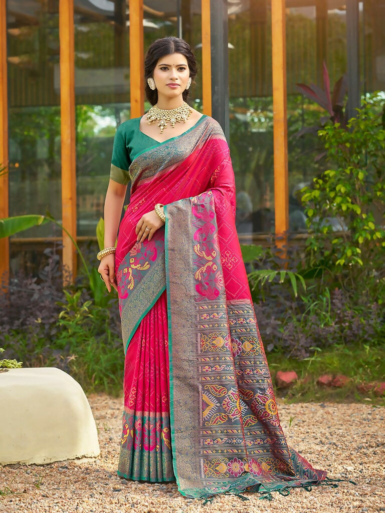 Red soft silk saree with a contrasting sea green blouse