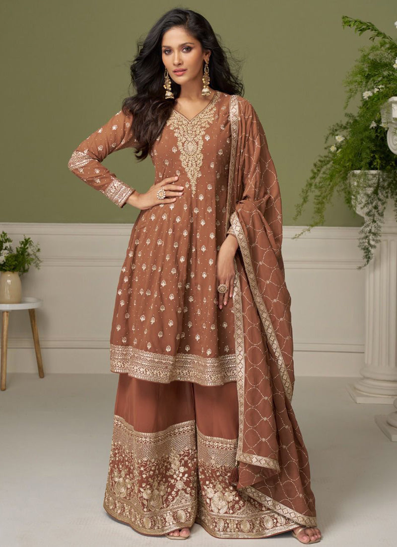 Brown georgette salwar suit with elegant embroidery for festive occasions.
