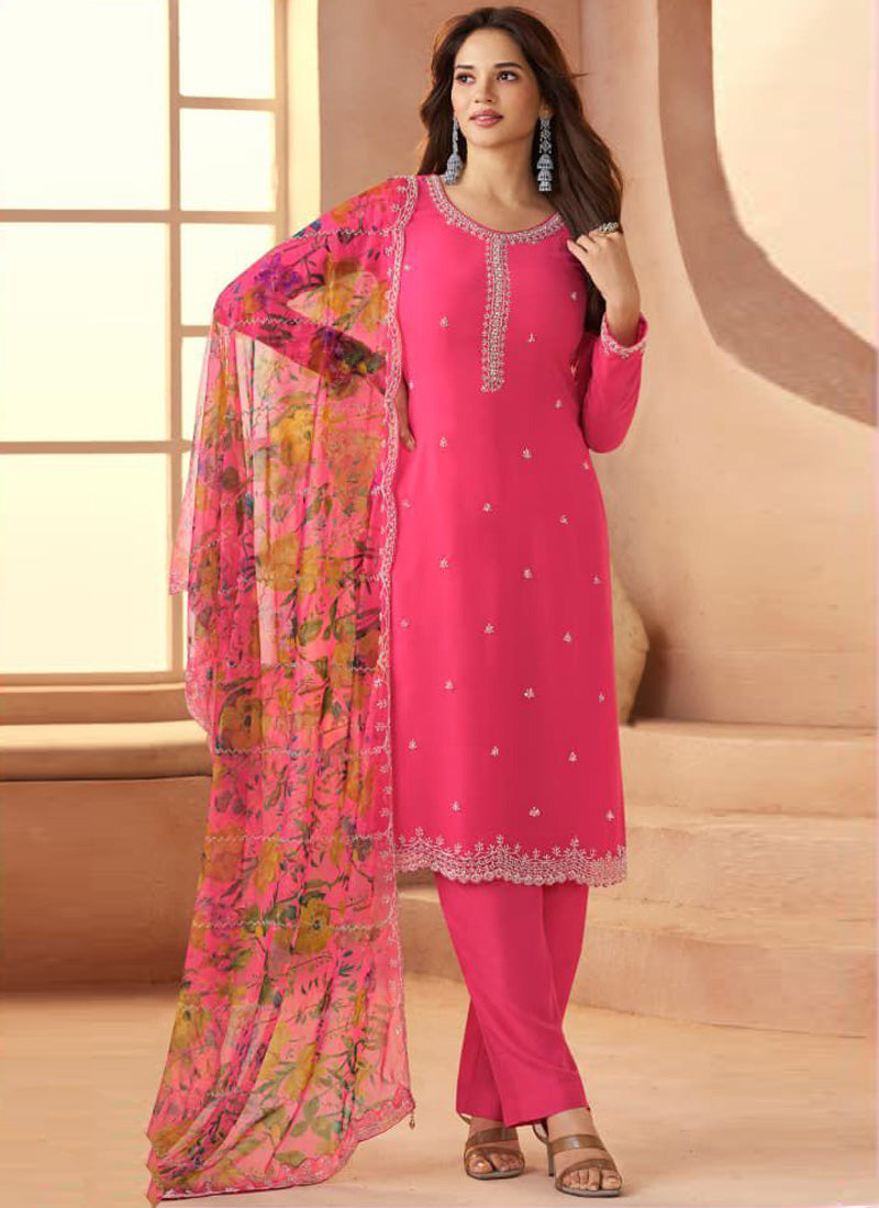 Woman wearing a pink soft chiffon salwar suit with art silk kurta for wedding events