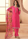 Woman wearing a pink soft chiffon salwar suit with art silk kurta for wedding events