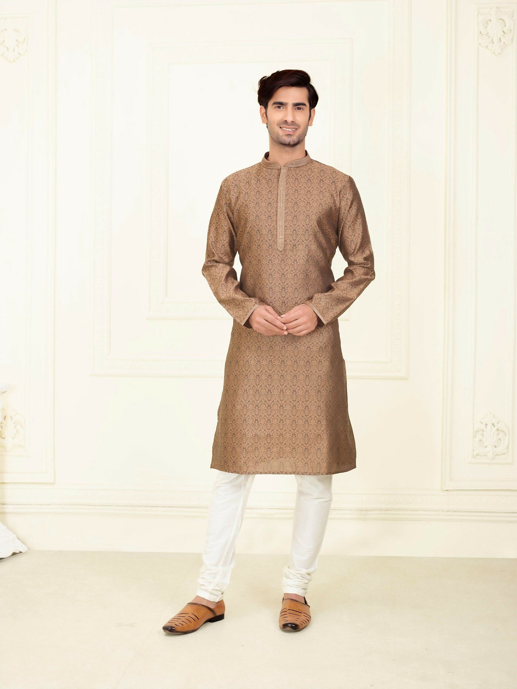 Baby boy wearing a dark brown jacquard kurta pyjama set with off-white bottoms
