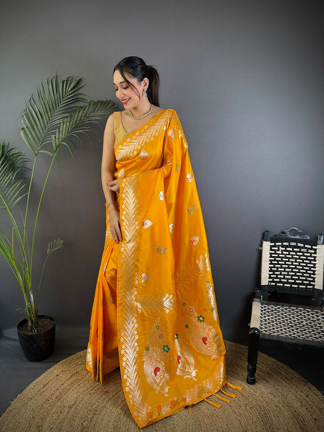 Vibrant orange woven Banarasi soft silk saree with matching blouse fabric.