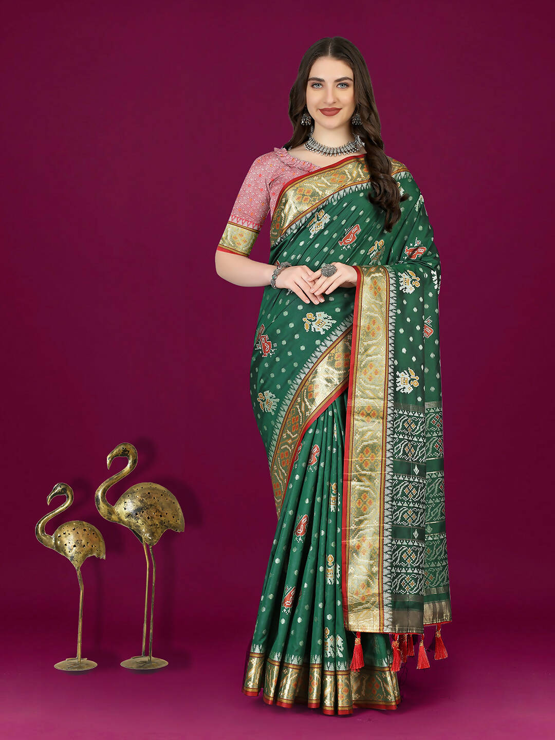 Green Patola silk saree with gold zari meenakari weaving and matching silk blouse