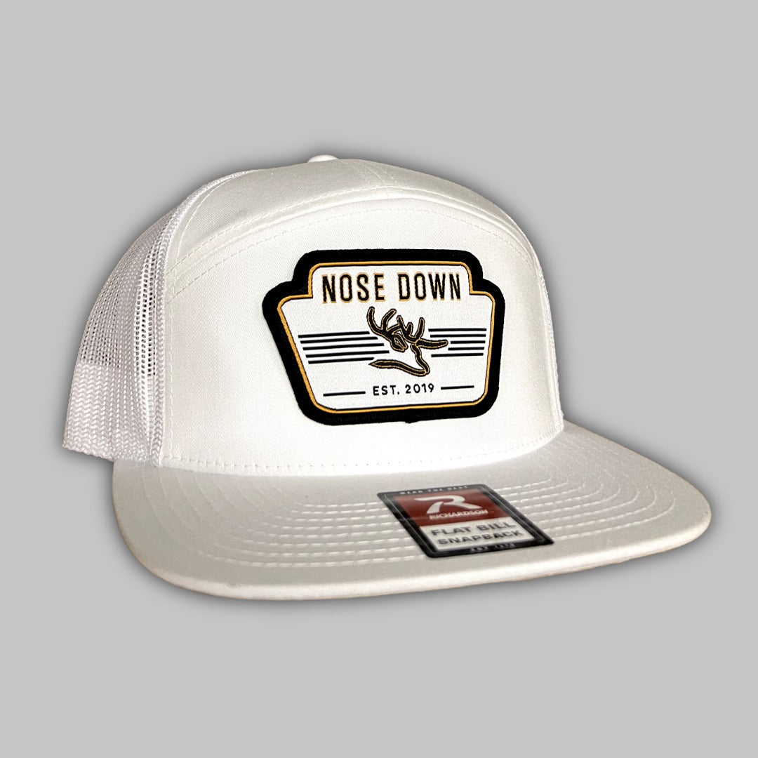 Vintage white 7-panel woven hat featuring a detailed NDS patch on the front crown.