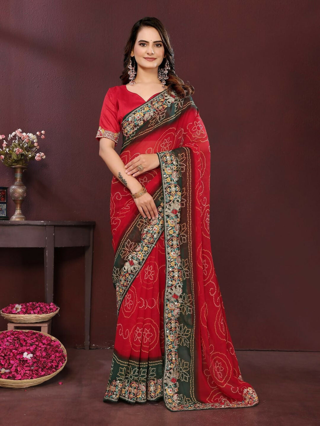 Model wearing a vibrant red digital print georgette party wear saree with matching blouse