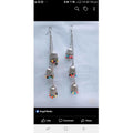 Kashmiri triple-tier jhumki alloy earrings with a tassel hook design for traditional style.