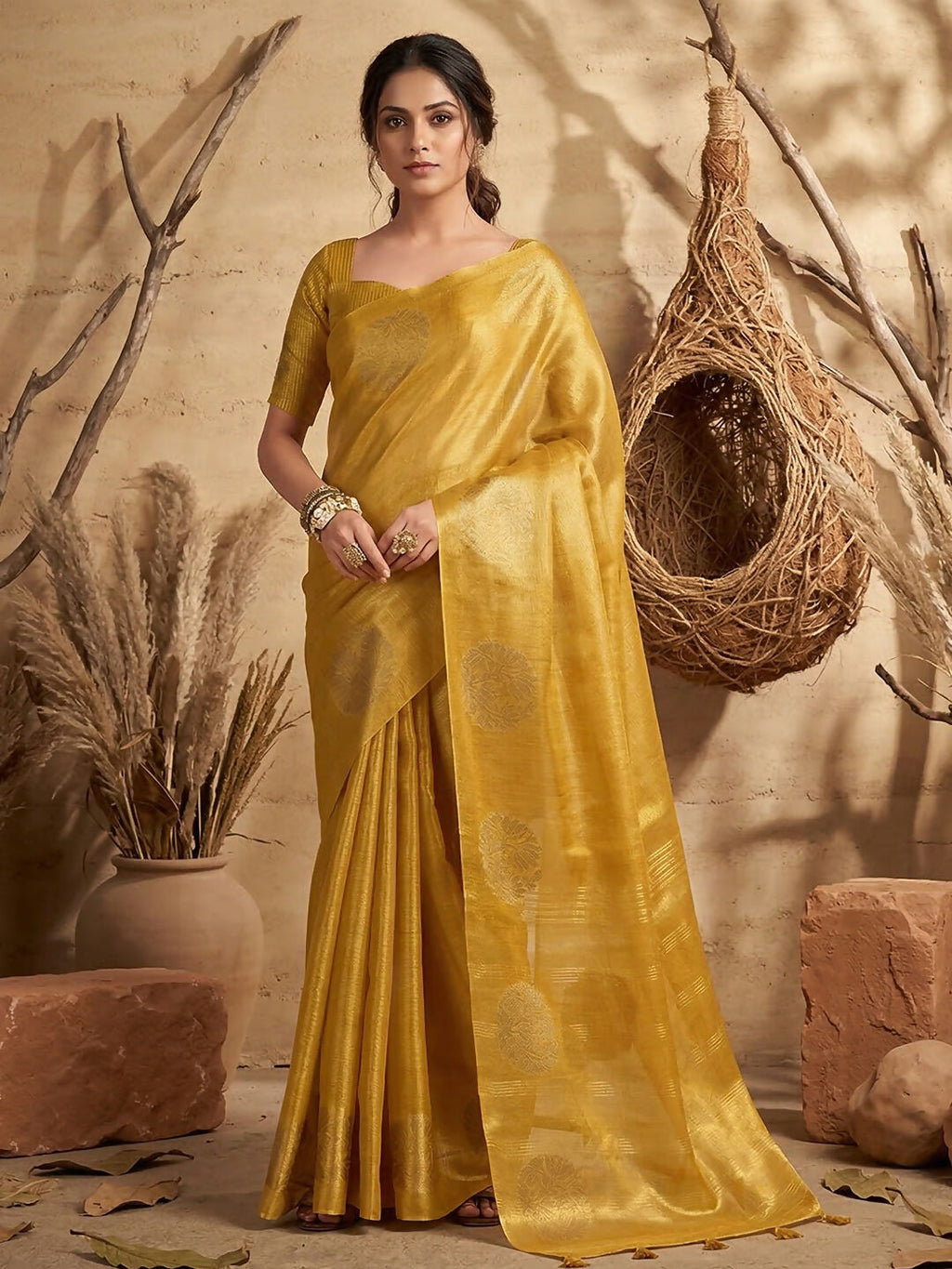 Bright yellow tissue silk saree with an elegant glossy finish and matching blouse
