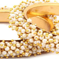 Elegant Gold-Polished Pearl Bangles for Women