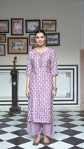 Women wearing a purple pure muslin A-line kurta with heavy digital print and 3/4 sleeves