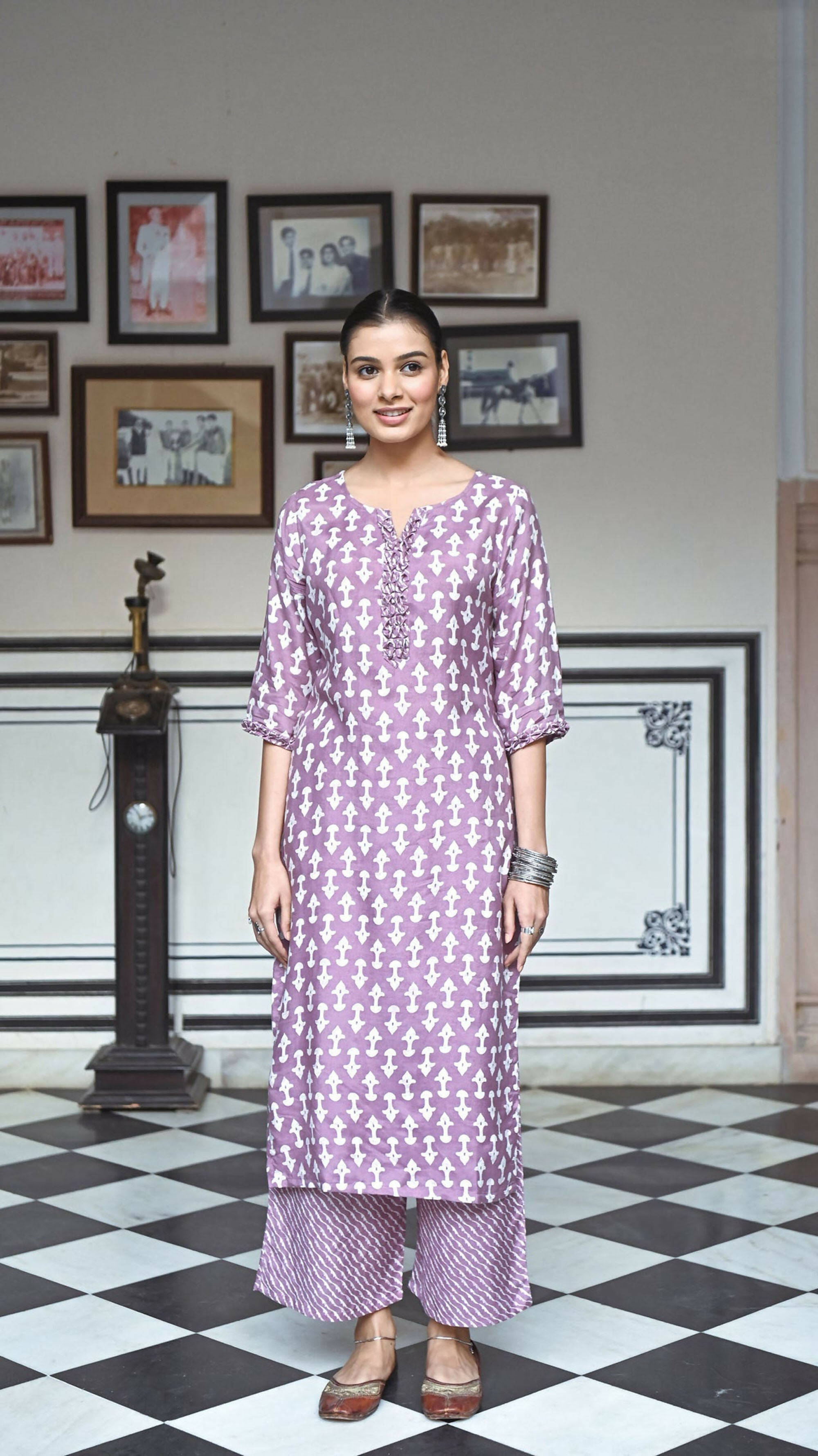 Women wearing a purple pure muslin A-line kurta with heavy digital print and 3/4 sleeves
