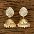 A pair of traditional golden white Kundan and Pearl drop earrings for women