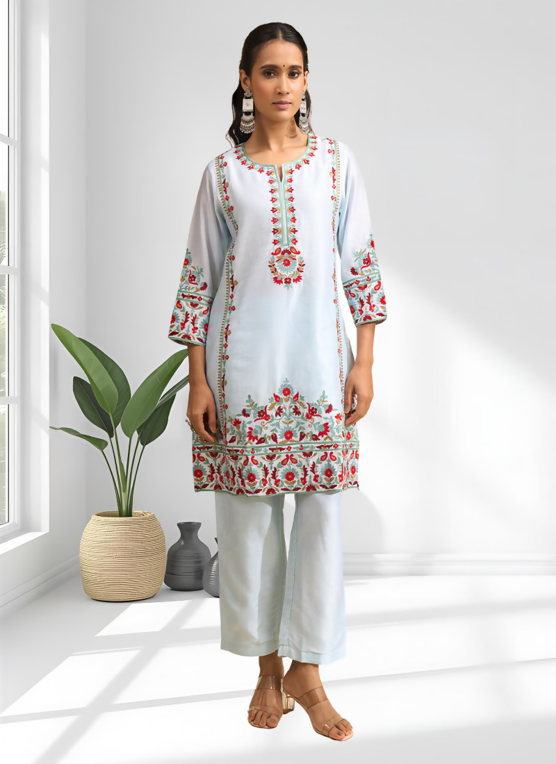 Sky blue silk long kurta with embroidery and matching pant set for women.