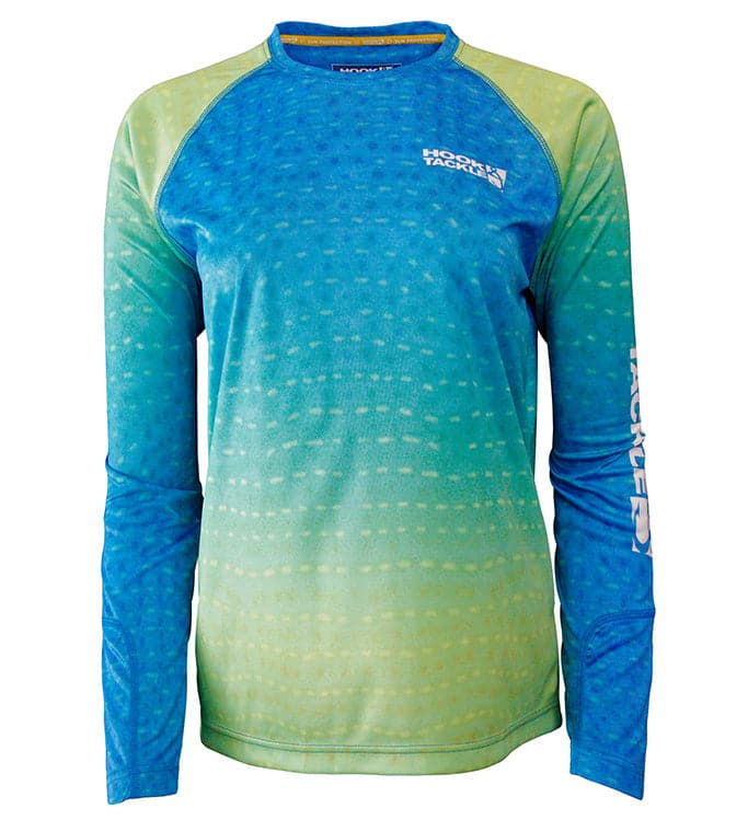 Woman wearing a long-sleeved blue and green whale shark patterned UV performance fishing shirt