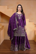 Model wearing a premium purple silk sharara set with intricate embroidery and wide-leg trousers.