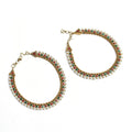 Close-up of gold-plated multi-color Kundan and pearl anklets for women, ethnic design