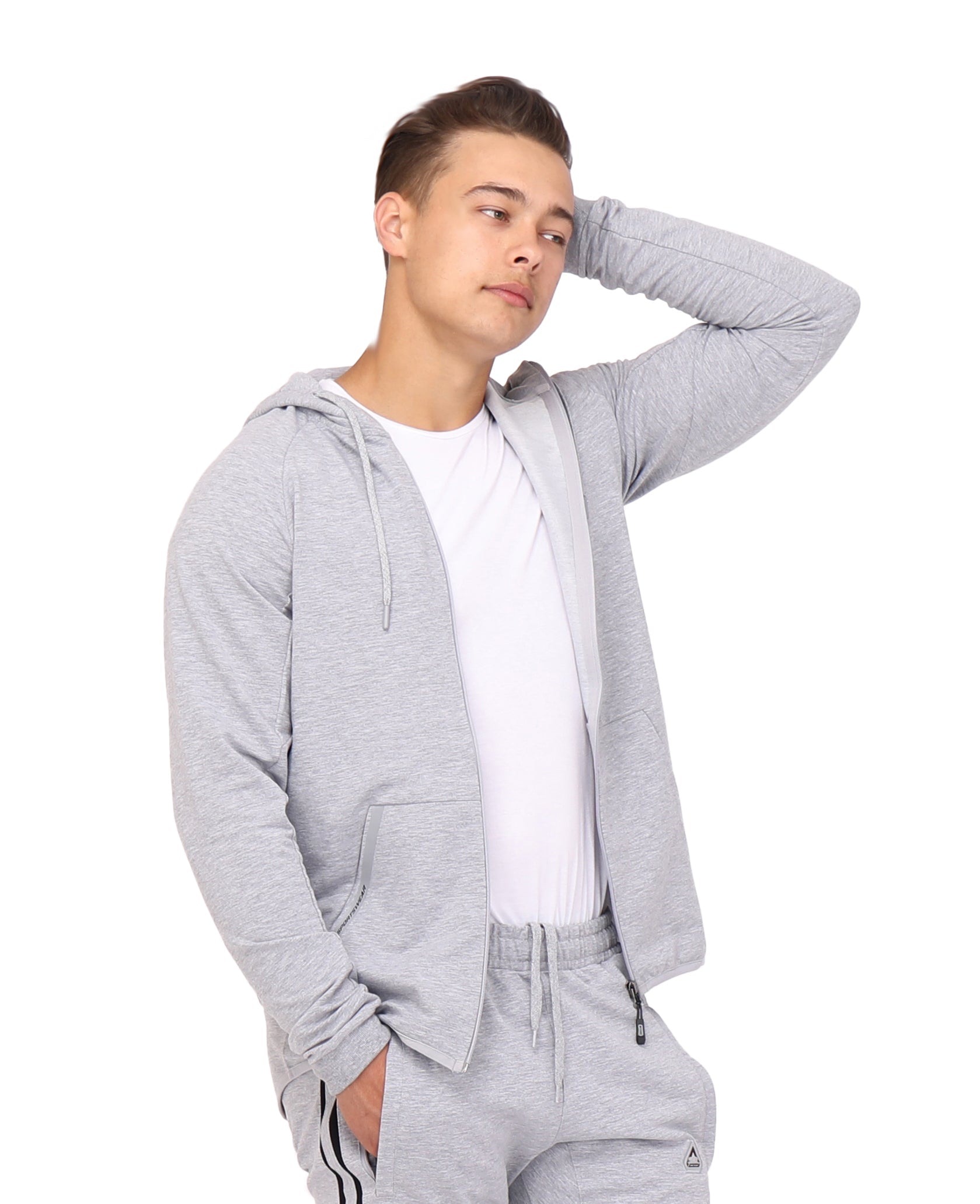 A man wearing a grey slim fit full-zip hooded sweatshirt with a drop-cut hem design