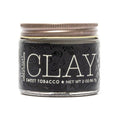 18.21 Man Made Hair Clay in a compact 2oz container