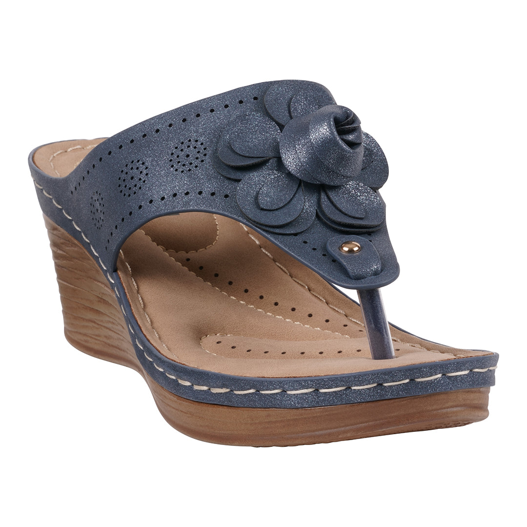 Blue floral wedge sandals with perforated strap and cushioned insole