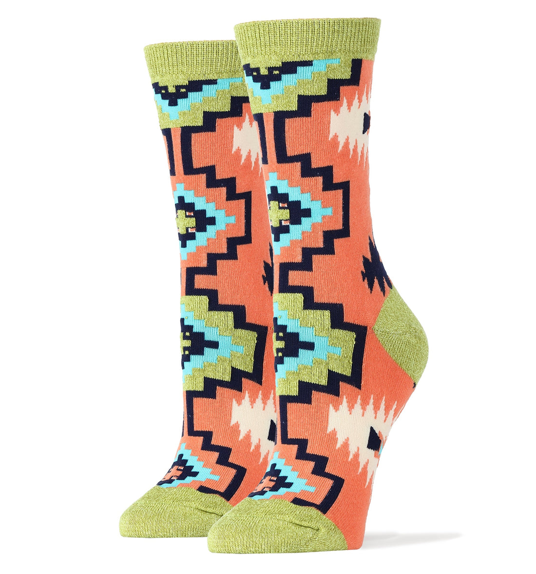 A pair of women's crew socks featuring a vibrant coral, green, and navy blue geometric southwest pattern