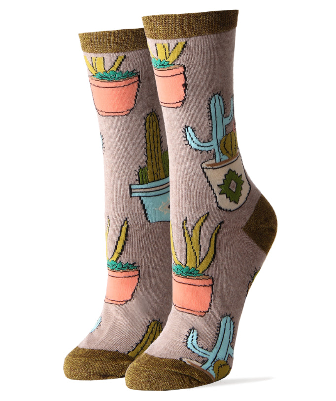 Women's crew socks with vibrant cactus print, made from a soft, breathable cotton blend.