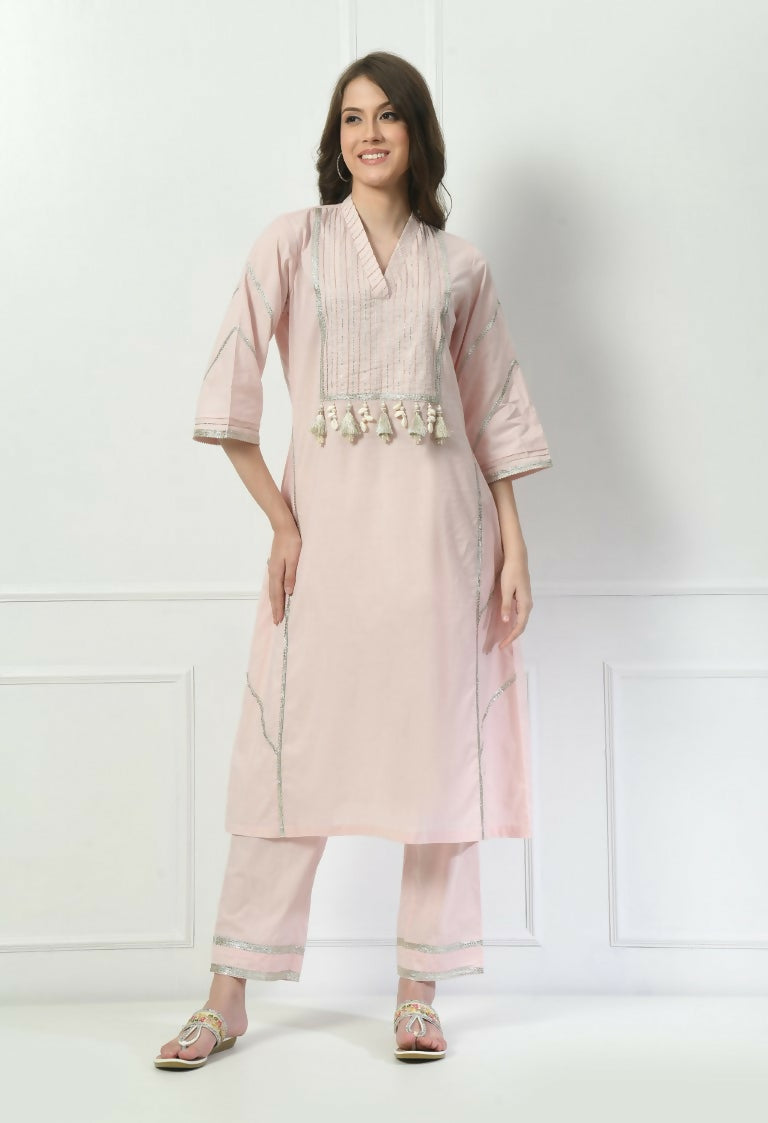 A beautiful cream cotton kurta set paired with a matching organza dupatta.