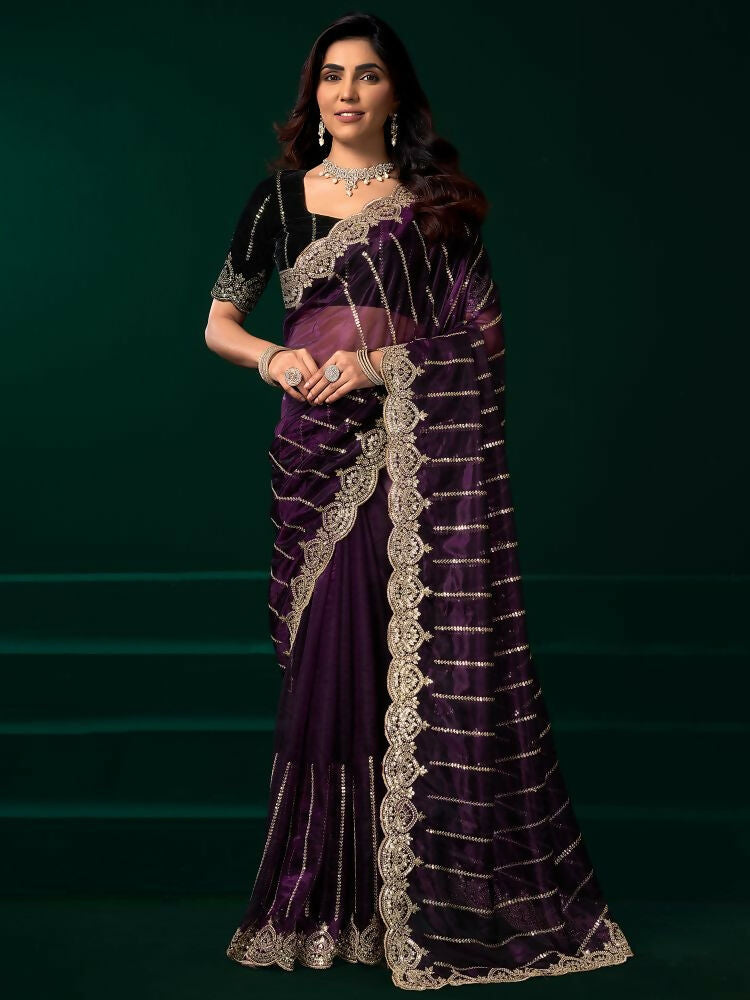 Elegant wine color net party wear saree with contrast black velvet blouse