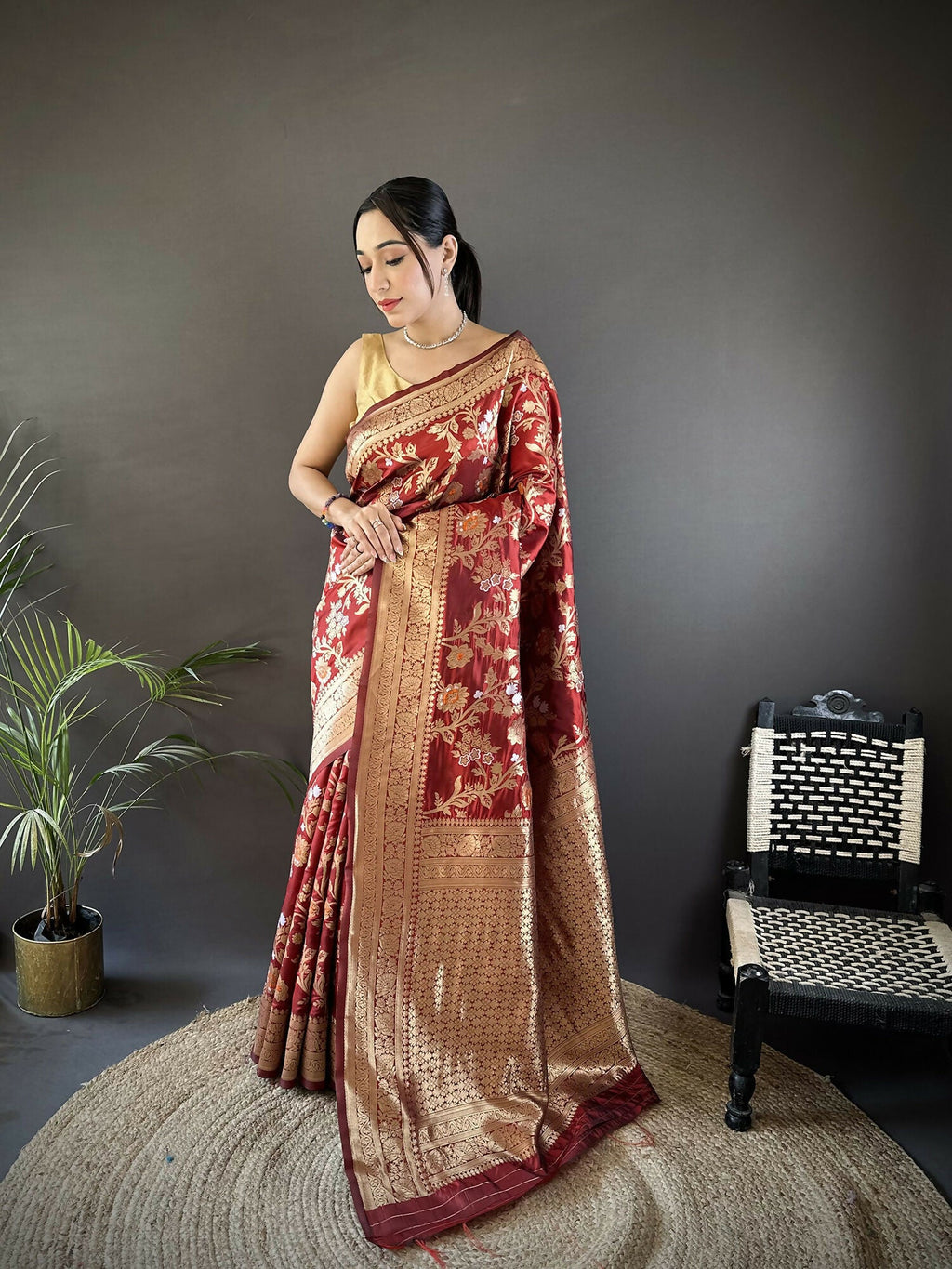 Maroon soft silk Banarasi saree with floral and ethnic Meenakari motifs