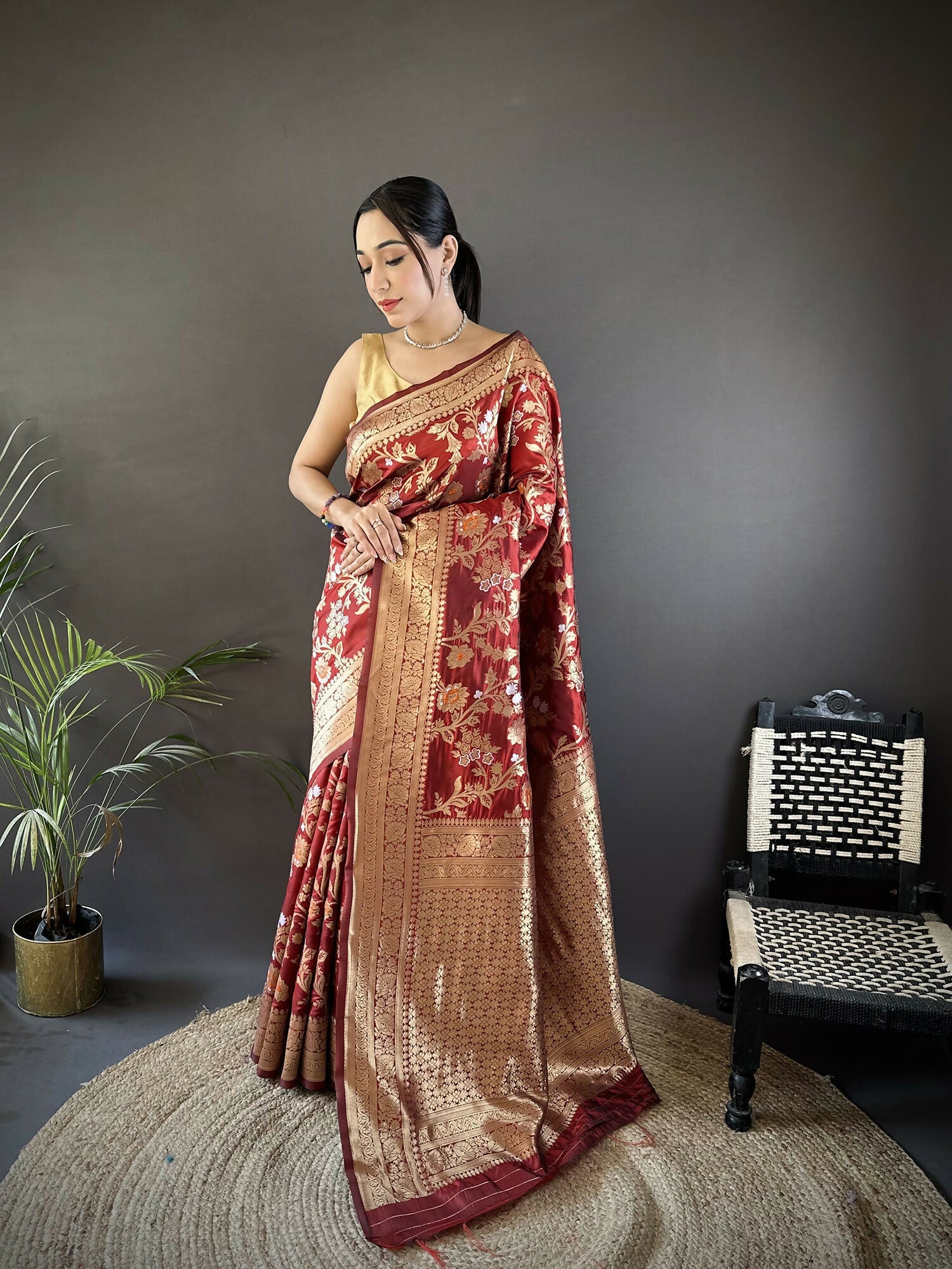Maroon soft silk Banarasi saree with floral and ethnic Meenakari motifs