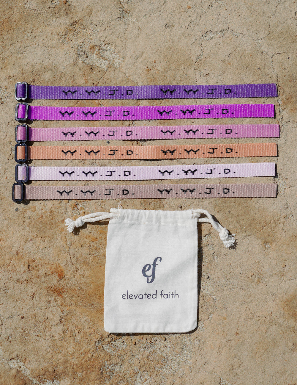 Set of 6 adjustable WWJD Paradise bracelets in various pastel and vibrant colors with an Elevated Faith drawstring storage bag