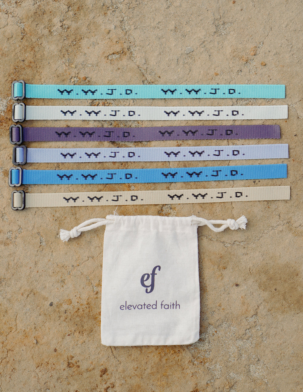 Set of 6 adjustable WWJD Surf bracelets in various colors with a branded drawstring pouch.
