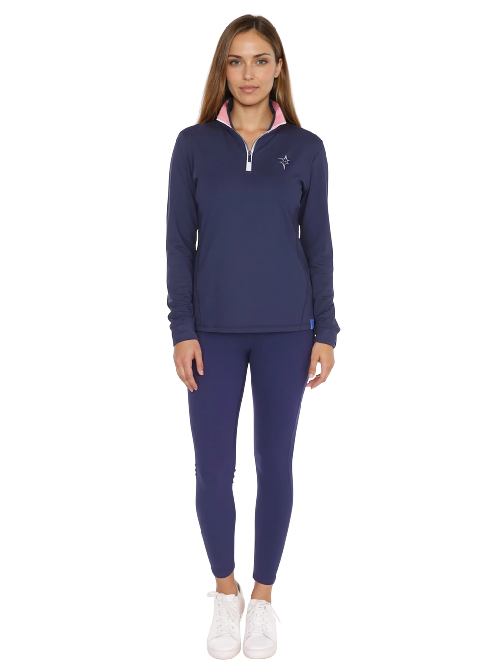 Woman wearing navy blue performance quarter zip top with pink inner collar detail