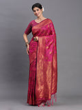A beautiful pink silk saree with a rich, luminous texture and matching blouse.