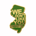 High-contrast Mutual Feelings enamel pin with a Garden State theme.