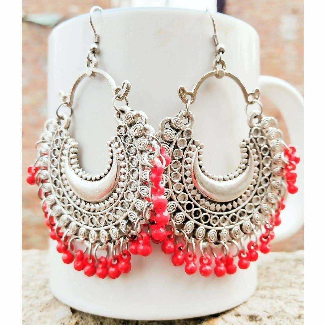 Colorful fancy hanging Chandbali earrings for party wear.