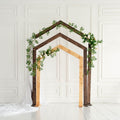 Pentagon-shaped wooden wedding arch for ceremony decor, decorated with floral accents