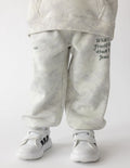 Kids wearing grey and white tonal camo print knit sweatpants with a relaxed, tapered fit.