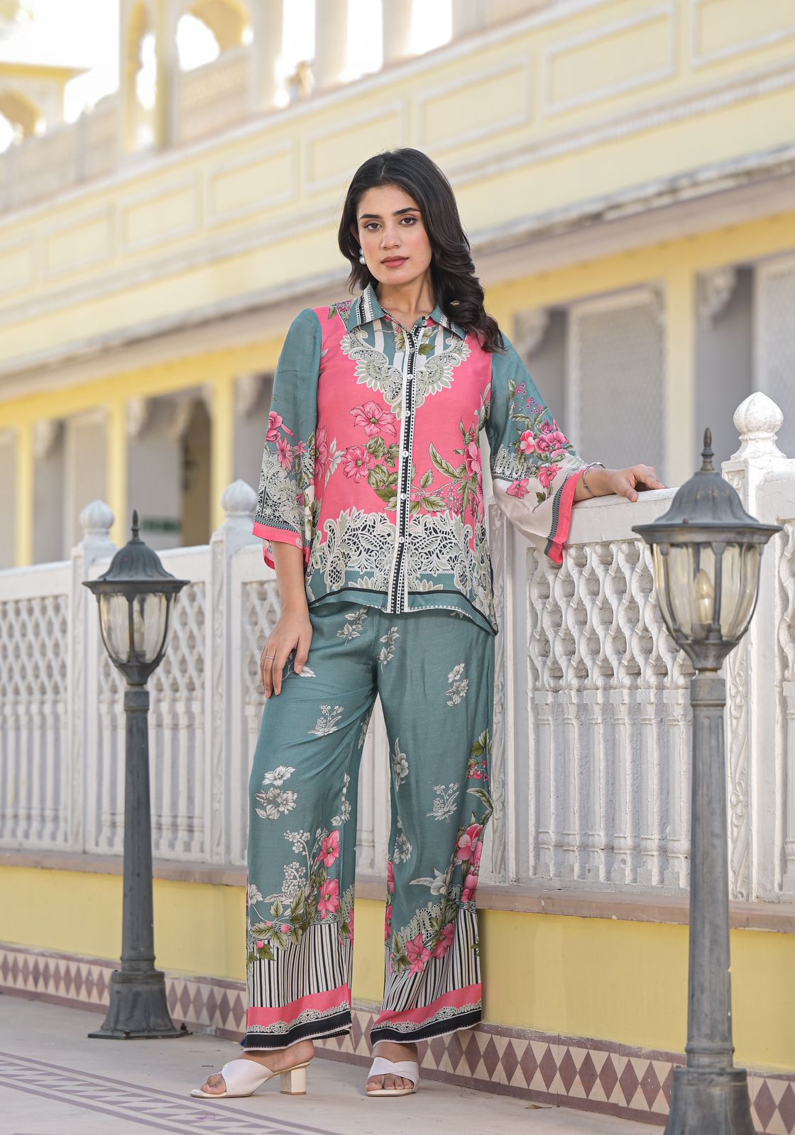 Model wearing a multicolor printed pure muslin shirt and pant co-ord set with 3/4th sleeves.