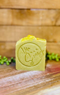 Green and yellow handcrafted Avocado and Hemp Seed Oil soap bar.