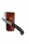 Titan Ironclaw Damascus folding knife with silver wave pattern blade and brown hardwood handle