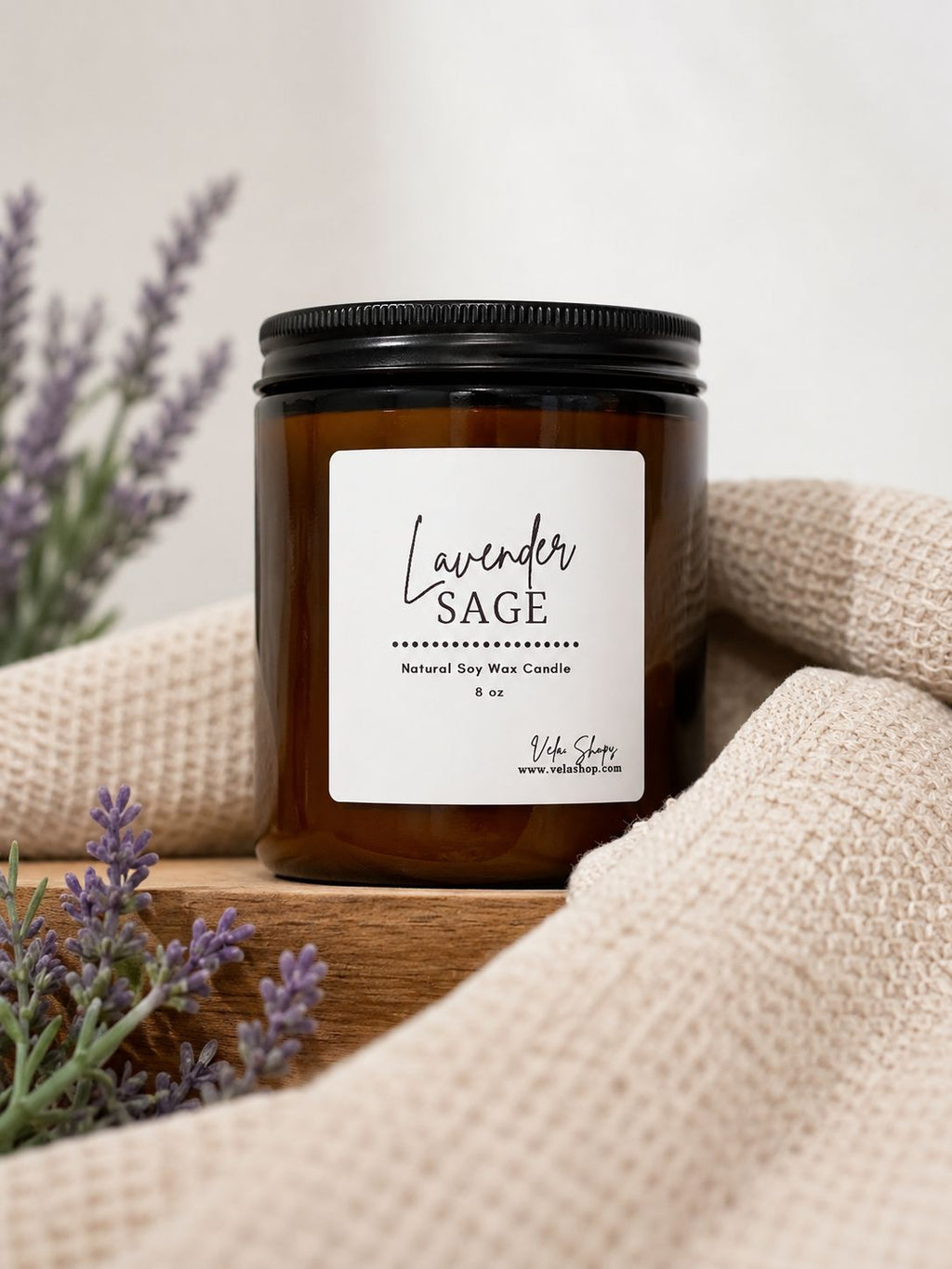 Sage + Lavender soy wax candle in a stylish glass container, perfect for home decor styling.