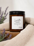 Sage + Lavender soy wax candle in a stylish glass container, perfect for home decor styling.